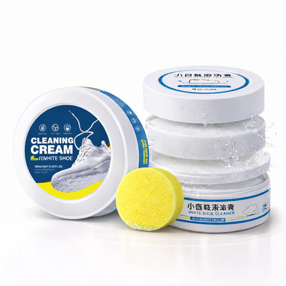 Cleaning cream for white shoes with a yellow sponge on a white background
