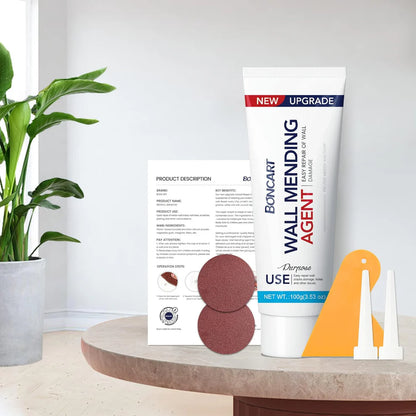 Bocanart wall mending agent with sandpaper and repair tool on a table with a plant in the background