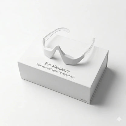 White eye massager on a white box with text on a white background